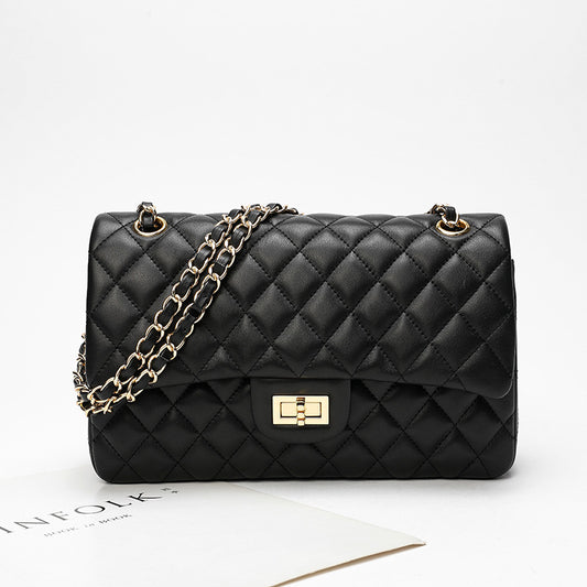 Bolso de mujer de piel con cadena y diamantes negros